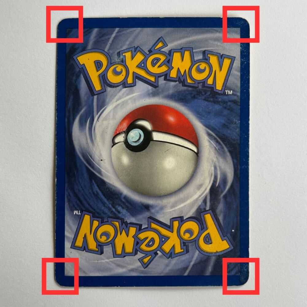 Baksidan av ett Pokémonkort med de fyra hörnen inramade i rött